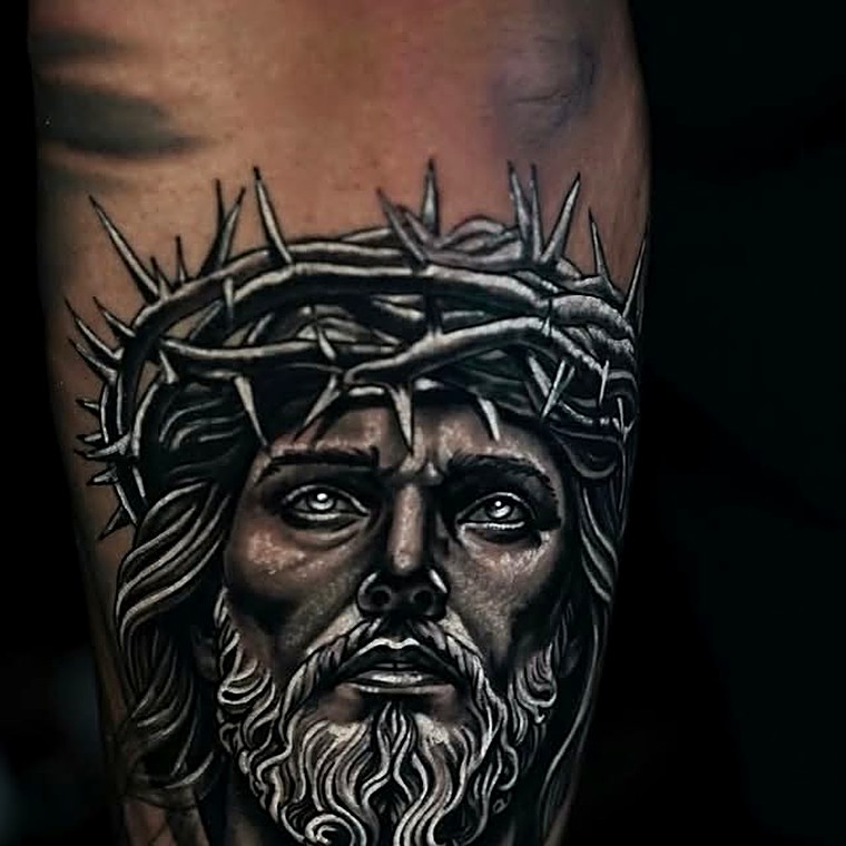Black and grey realism tattoo of Jesus wearing a crown of thorns